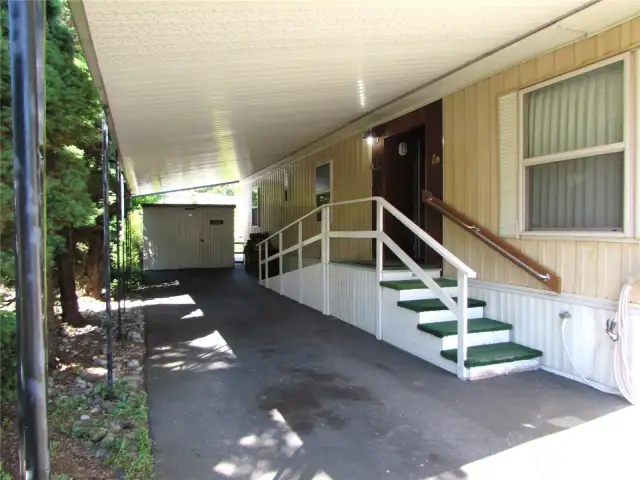 FULL LENGTH CARPORT W/ SHED.