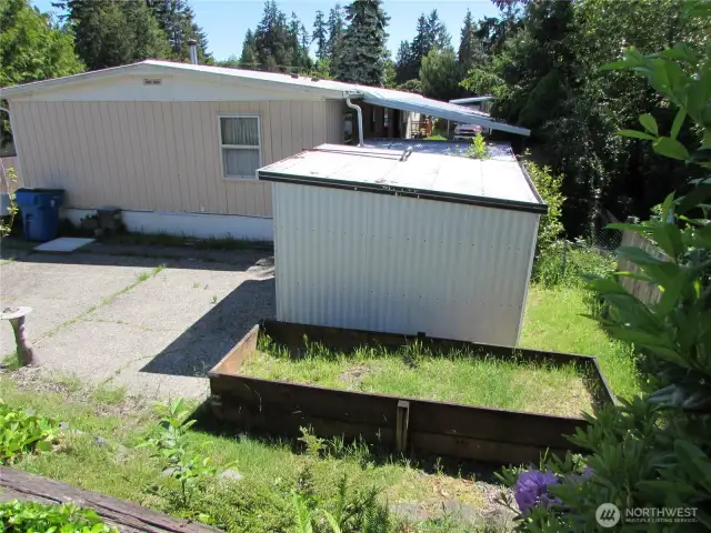 2ND STORAGE SHED, RAISED GARDEN AND TERRACED GARDEN AREA.