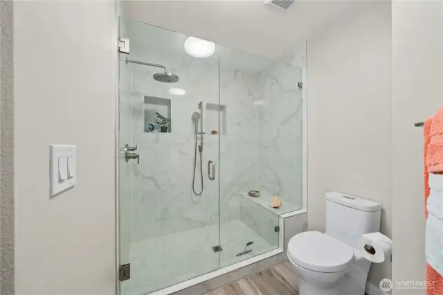 The upstairs bathroom also has a luxury shower with a rain shower head and hand shower.