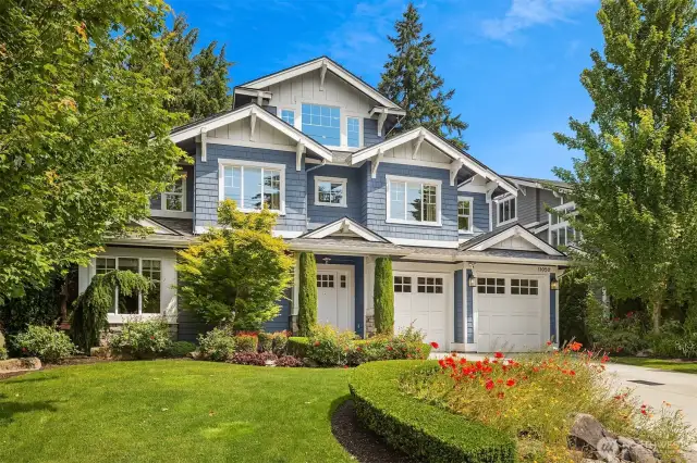 From the crisp blue facade to the vibrant landscaping, this Enatai stunner checks every box before you even step inside.
