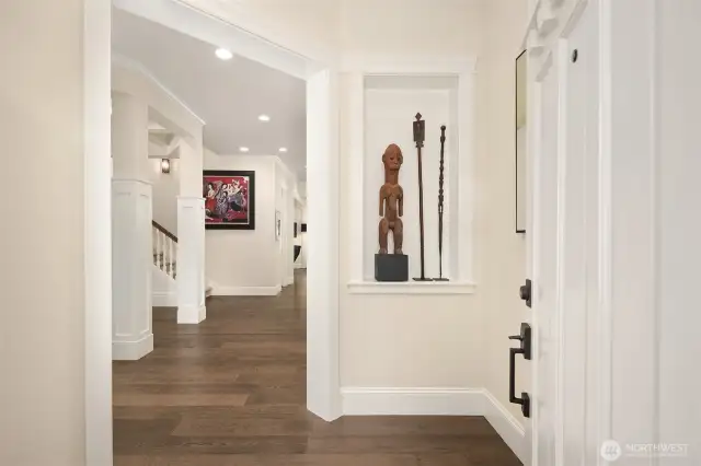 Warm and welcoming entry with rich hardwood floors, elegant millwork, and thoughtful architectural details that set the tone for the rest of the home.