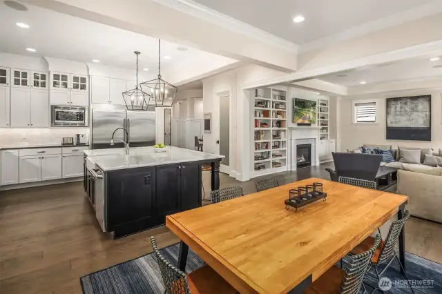 Open-concept living at its finest—where the kitchen island is command central, the dining table hosts everything from pancakes to projects, and the cozy great room is just a few steps (and snacks) away.