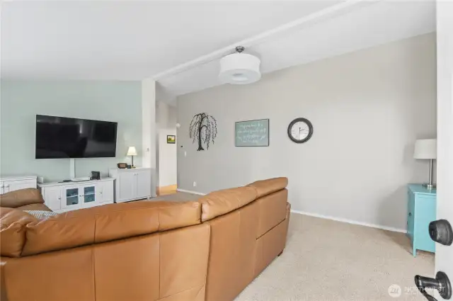 Large great room design with vaulted ceilings.