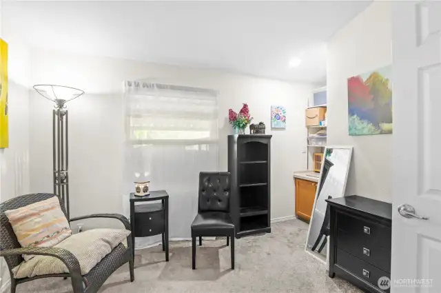 Den with double door entry.