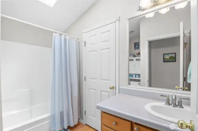 Main bathroom with full tub. Featuring Jack n Jill doors to laundry room and main inside hallway.