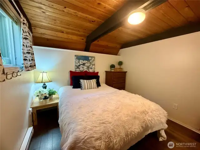 Primary bedroom on the main floor next to bathroom.