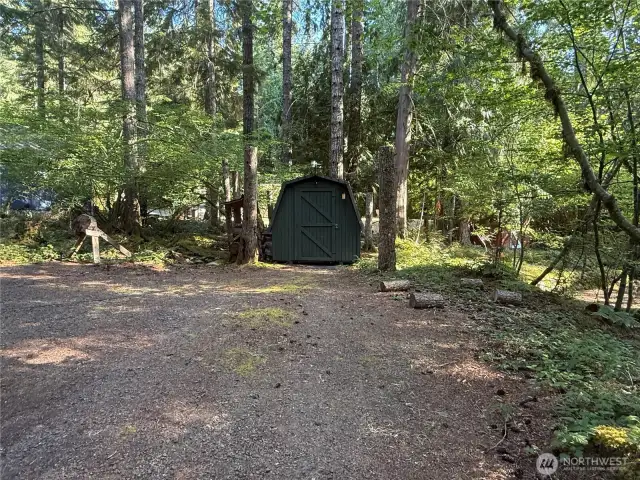 Good size outbuilding w/ shelving.