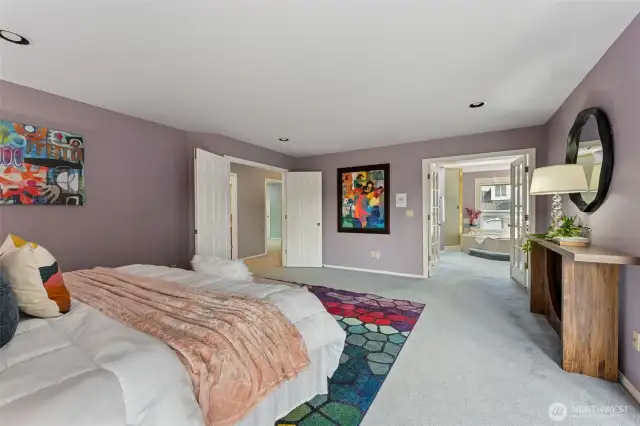 Looking from the sitting area to the primary suite and 5 piece bathroom