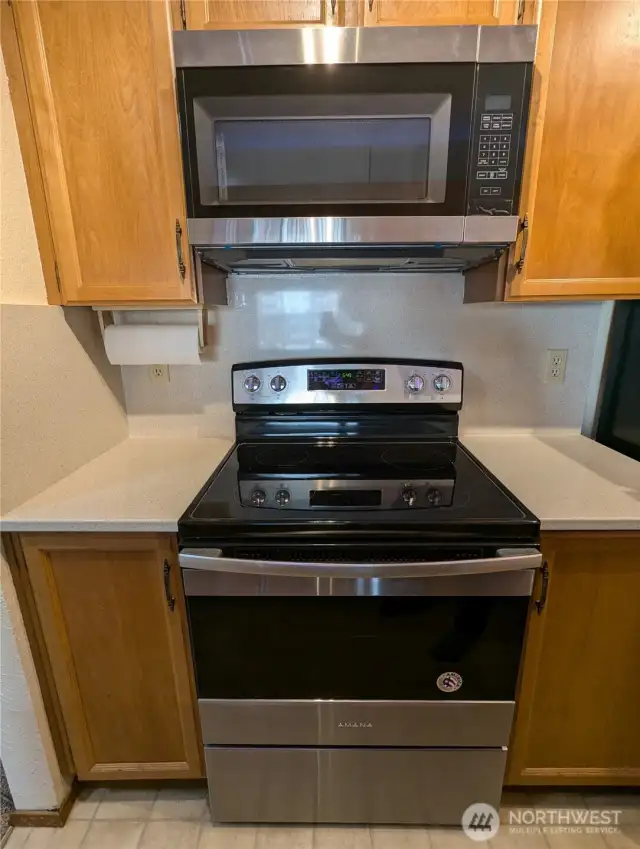 New stainless microwave hood above stove