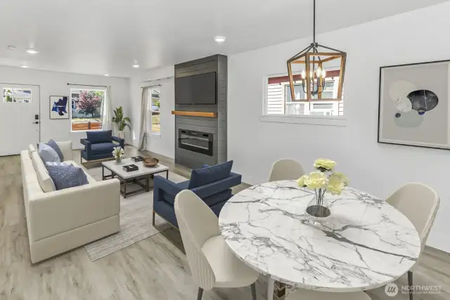 Virtually staged. View from dining room into living room and front door