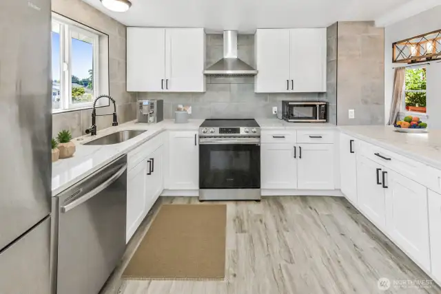 Virtually staged. Updated kitchen with beautiful quartz counters and SS appliances