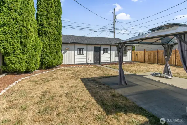 View of detached garage and gazebo