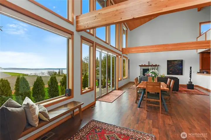 From the moment you enter this beautiful home, the exposed beams, wall of windows and soaring ceilings will draw you in.