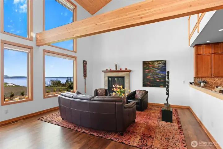 The end of the great room with expanded water view and beautiful hearth with propane fireplace.