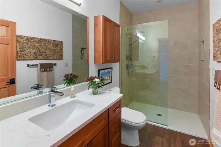 Lovely .75 bath just around the corner from the media room.