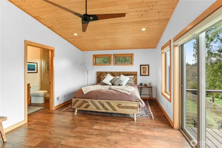 Second ensuite bedroom with .75 bath and deck via the slider.