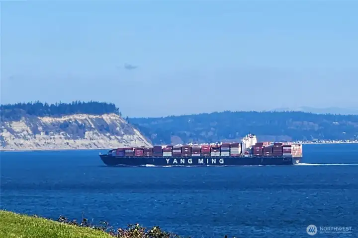 Another ship going off to sea. In the back ground are the cliffs of Whidbey Island.