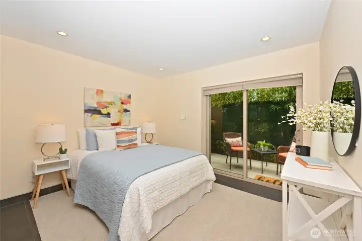 Primary bedroom with slider to private patio.