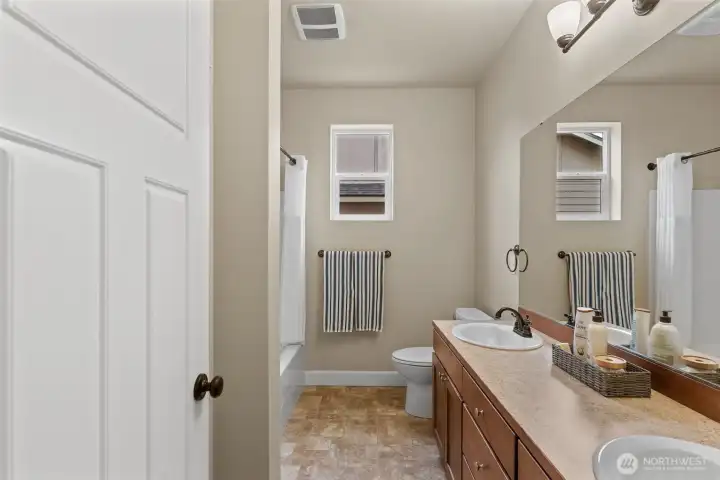 Second bath with double sinks.