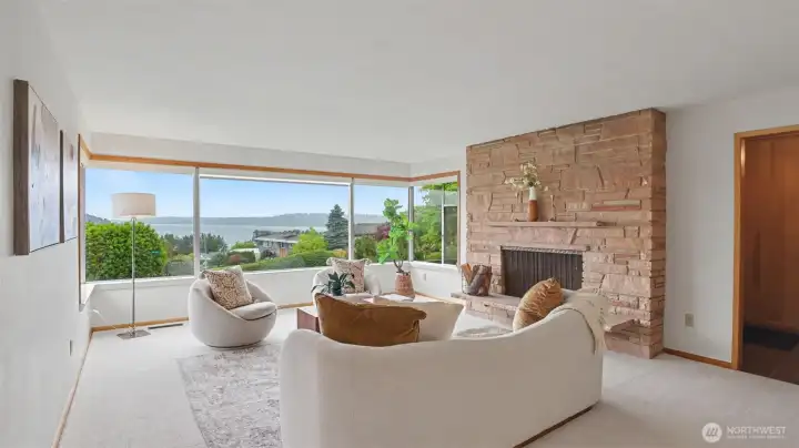 Living room with fireplace and views of the lake.