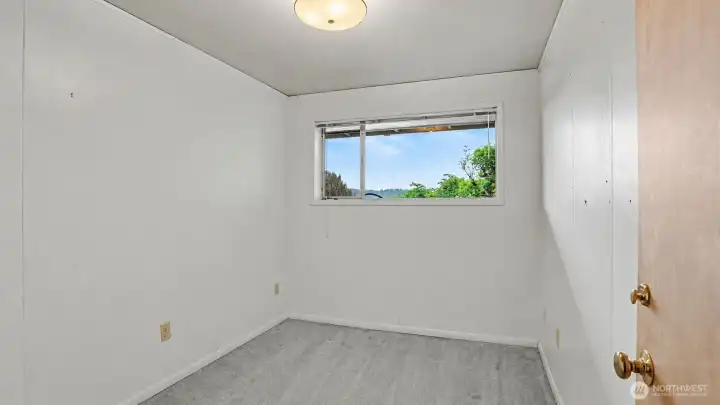Guest bedroom #3 downstairs, it would make a great office!
