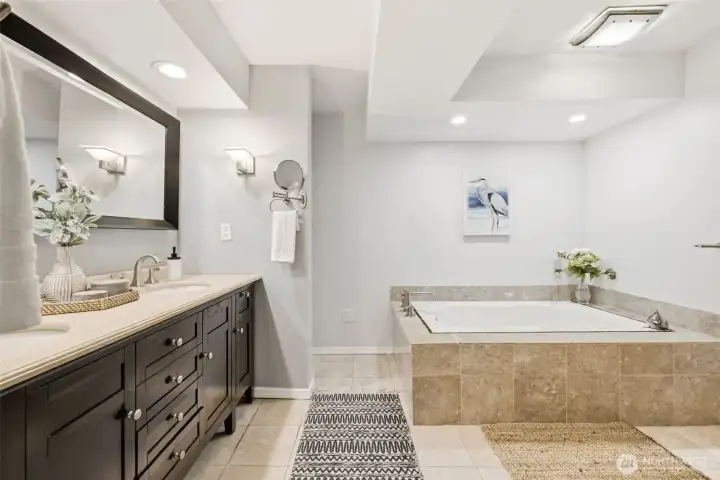 huge ensuite bathroom with a jacuzzi tub