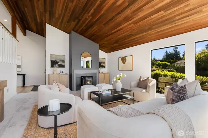 Fireplace, natural wood ceiling, plenty of windows and natural light
