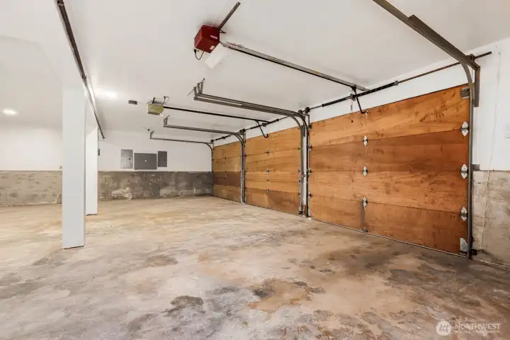 Massive 3 car garage with built-in shelving
