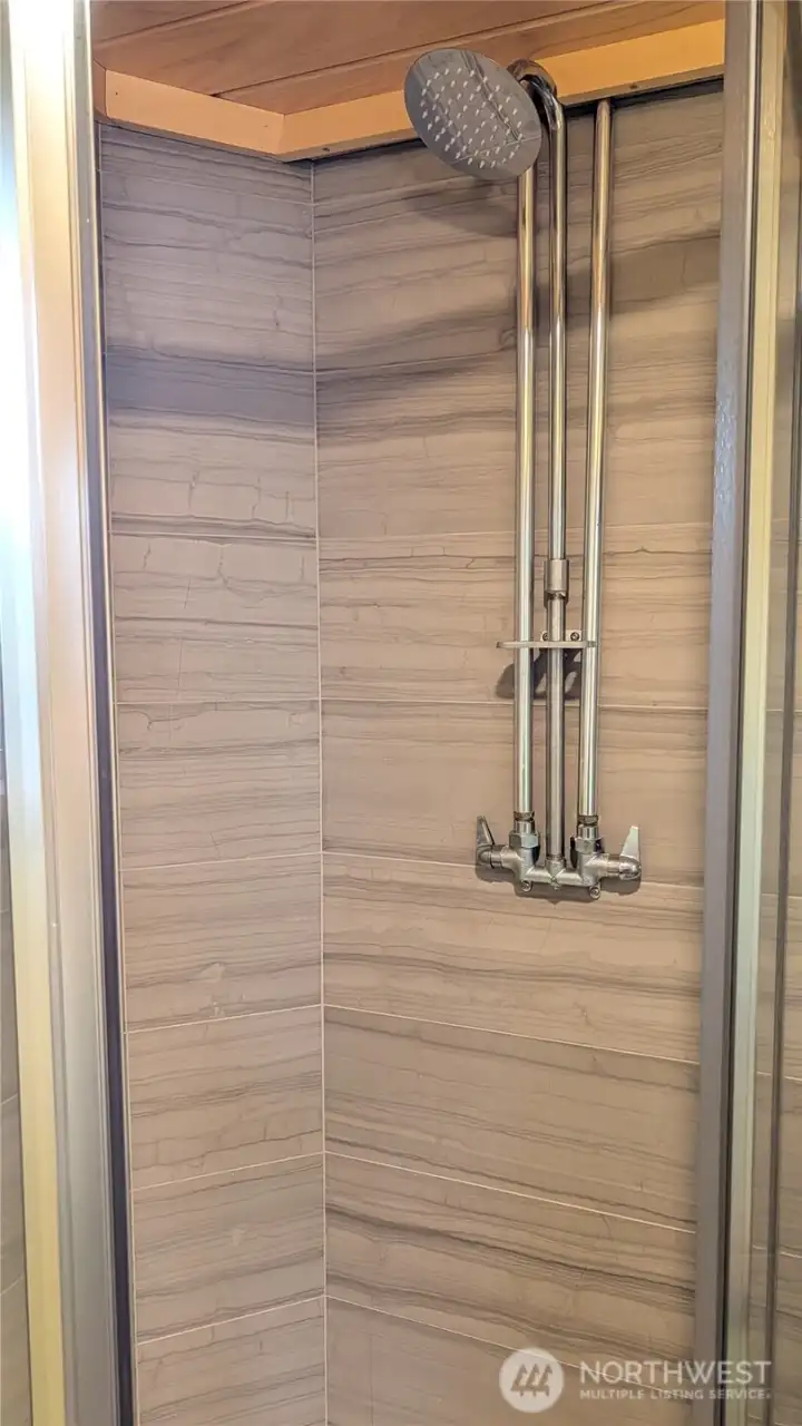 New travertine tiled shower