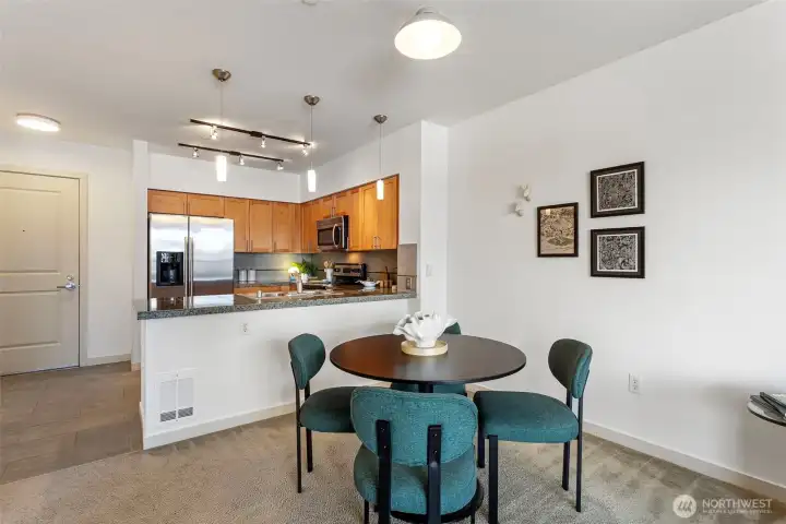 Dining area, there's also bar seating at the kitchen counter area Dining area, there's also bar seating at the kitchen counter area
