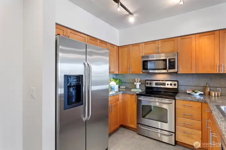 Open concept kitchen with SS appliance suite Open concept kitchen with SS appliance suite