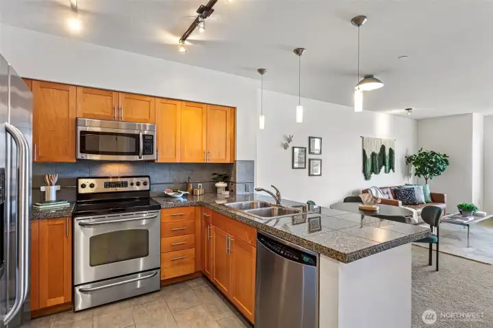 Kitchen has great storage and tons of counter space with bar seating Kitchen has great storage and tons of counter space with bar seating