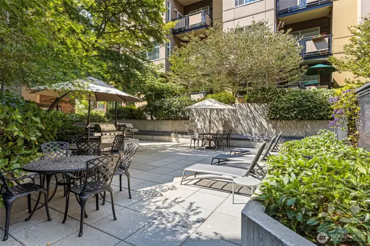 Amenities: outdoor seating and BBQ area located on level 2 Amenities: outdoor seating and BBQ area located on level 2