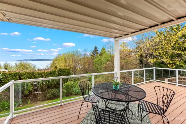 This covered deck and Sound view is a just off the kitchen.