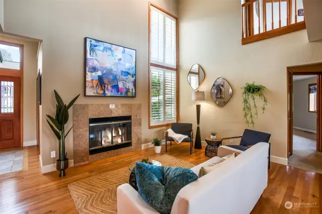 Open  living area features one of three fireplaces all with gas starters.