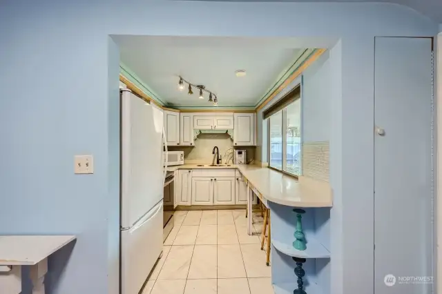 Main kitchen with ample cabinet and counter space.