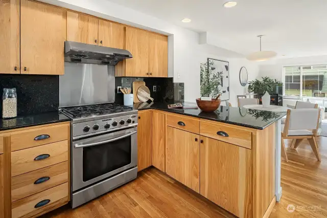 Plenty of counter space, a quality gas stove, and great flow into the living space. A pantry is just to your right.