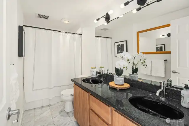 En suite bathroom with jetted tub.