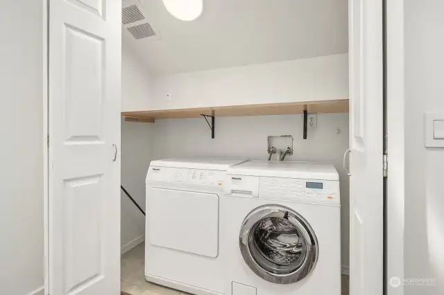 Laundry closet (Miele machines) just outside the bedroom doors. Convenient!