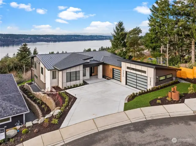 For the modern minimalist, this is your dream home! Thoughtfully designed with clean lines and enhanced with elegant finishes both inside and out, it exudes contemporary sophistication. Enjoy breathtaking front-row views of the Tacoma Narrows Bridge, Puget Sound and the Olympic Mountain Range, perfectly complementing the home's refined design