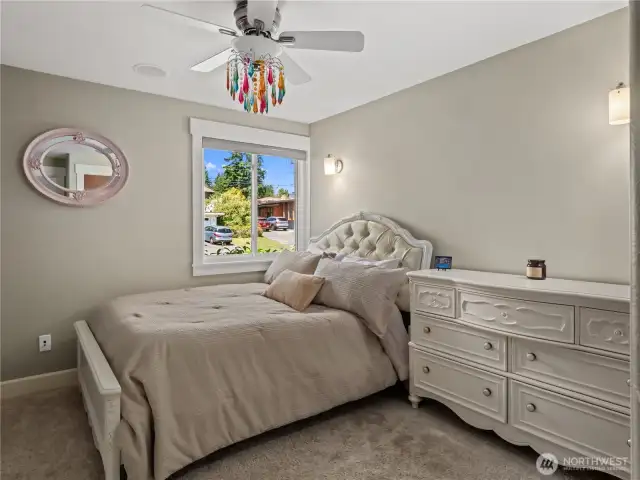 The secondary bedroom, designed for comfort and style.