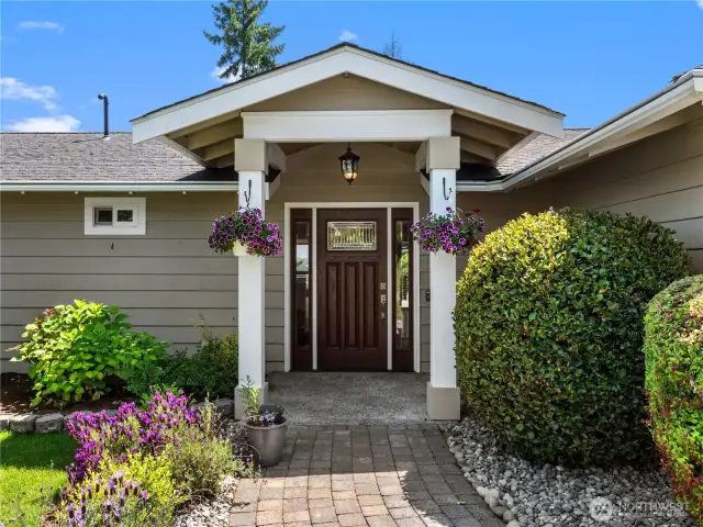 Step into comfort through this home's impressive front entryway, designed to make a statement.
