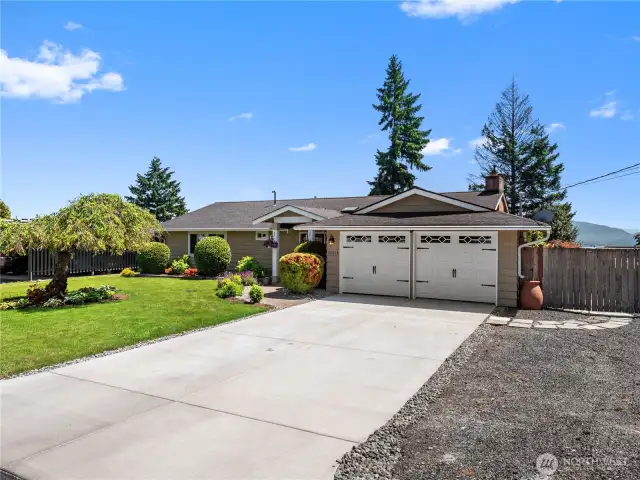 A long, newly-paved driveway provides ample parking and brand new garage doors make this home shine.