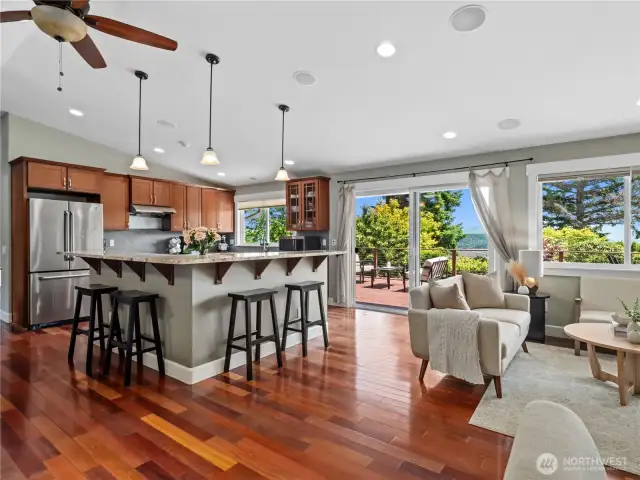 Rich hardwood floors greet you and extend throughout the main living areas, leading to a modern kitchen.