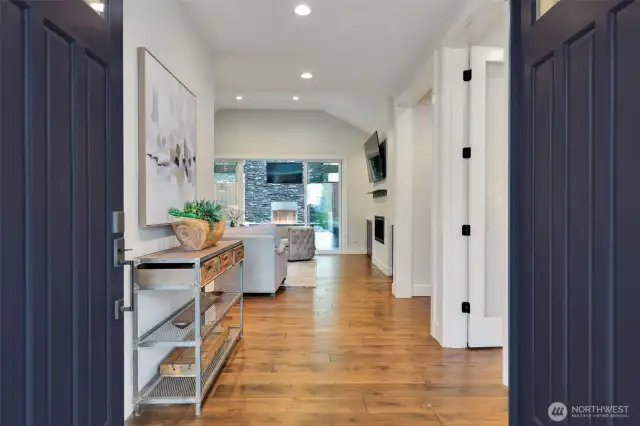 An inviting French door entry opens to reveal a bright, spacious interior, seamlessly extending into the family room and outdoor living beyond. Every detail exudes custom craftsmanship and luxury, from the elegant finishes to the 8-foot doors with four hinges, a testament to the home’s superior quality. A true distinction of exclusivity and thoughtful design, setting this residence apart from the rest.