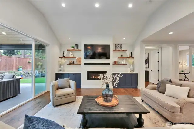 To the right is the entry, then the office, followed by French doors into the primary suite.