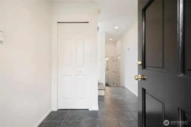 Entry - leads to first floor bedroom, full bathroom & garage + storage!
