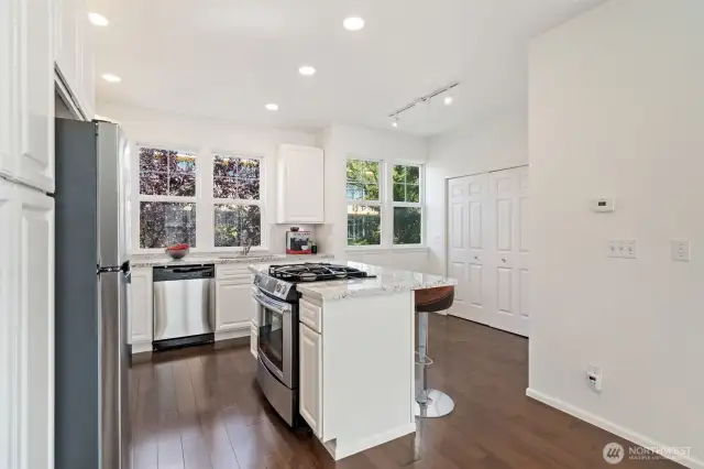 Updated kitchen with new stainless refrigerator, microwave, dishwasher & gas range.