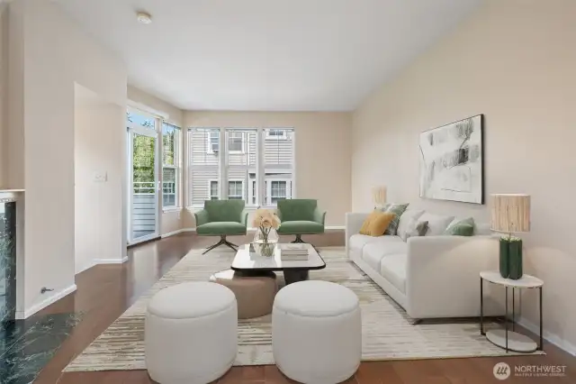 Open concept living and dining area with gas starter fireplace and view deck - virtually staged to show potential. Wood floors gleam! Virtually staged.