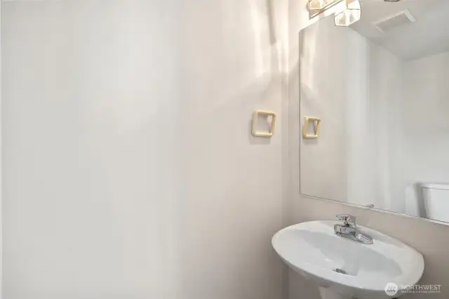 1/2 bath for easy access from living, dining, kitchen areas.
